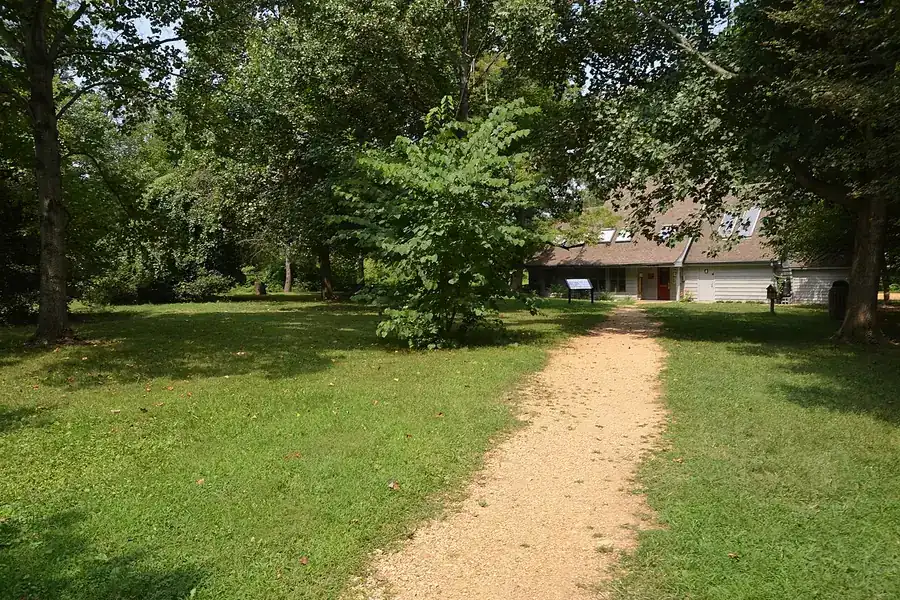 Gravel path across a shaded lawn to the visitor center at Piscataway Park in Accokeek, Maryland