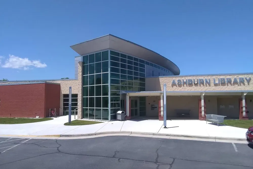 Ashburn Library entrance with a glass front and a curved roof in Ashburn, Virginia