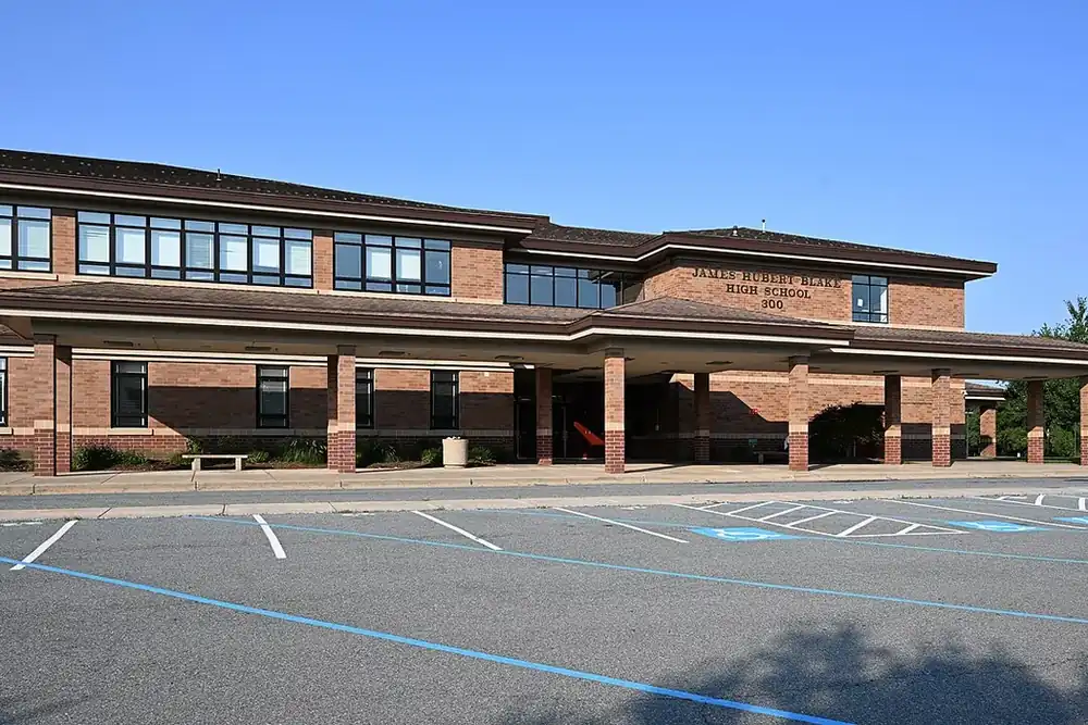 Brick James Hubert Blake High School building with a covered entrance in Cloverly, Maryland