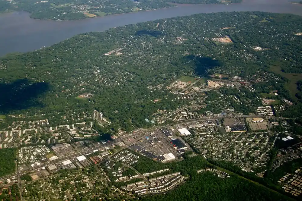 Aerial view of Hybla Valley neighborhoods, forest and the Potomac River in Virginia