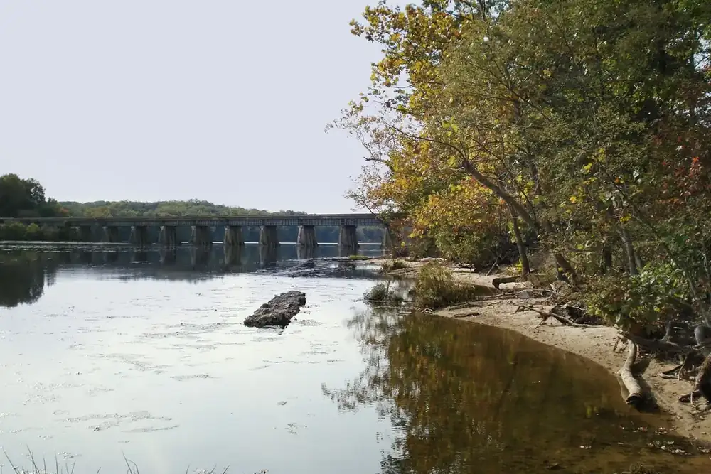 Tree-lined Potomac River shoreline and calm water at Leesylvania State Park, Virginia