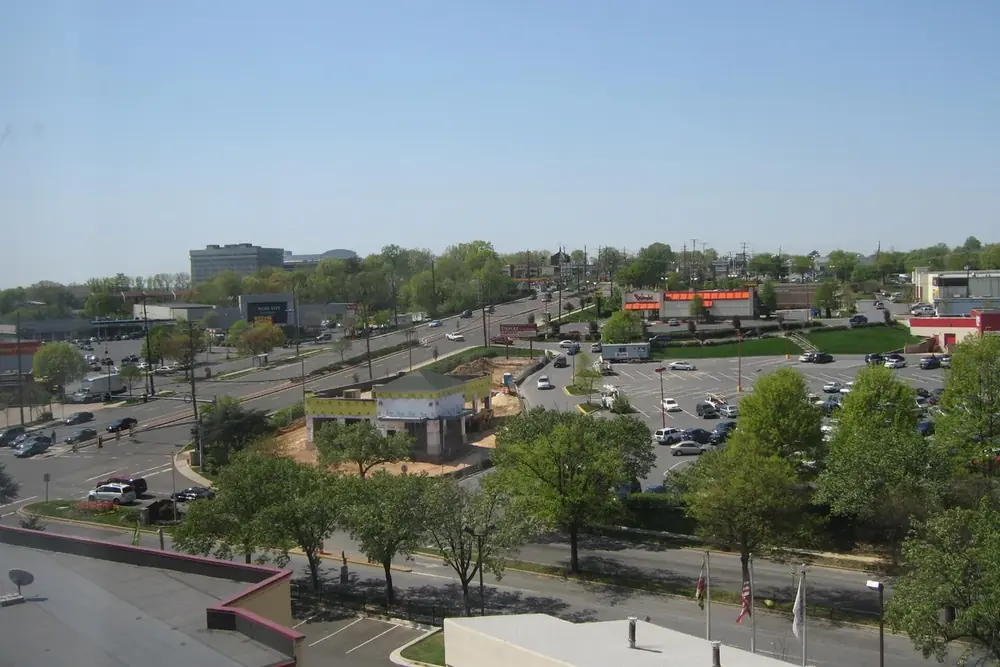 Wide view over Annapolis Road, shops and leafy streets in New Carrollton, Maryland