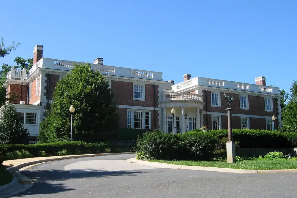 Brick Strathmore mansion with white balustrades behind a curved drive in North Bethesda, Maryland