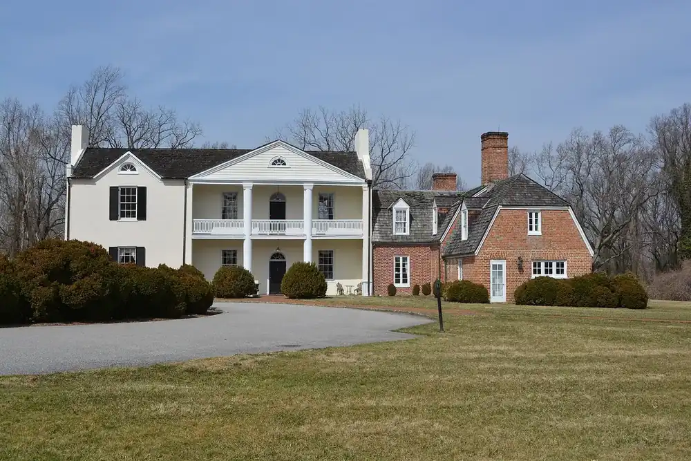 White columned Mount Airy mansion and brick wing in Rosaryville State Park, Rosaryville, Maryland