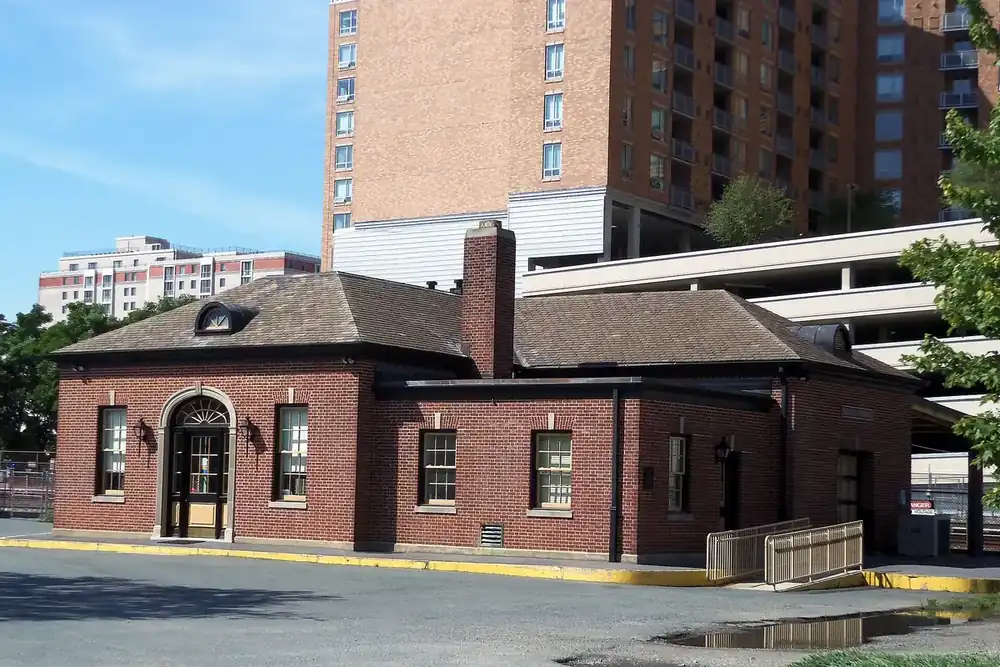 Restored brick B&O railroad station below apartment towers in downtown Silver Spring, Maryland